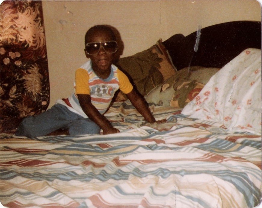 Devon as a kid — already wearing sunglasses